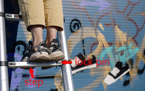 a girl standing on a telescopic ladder, graffiti with telescopic ladder